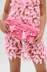 WITH A BOW CLUTCH